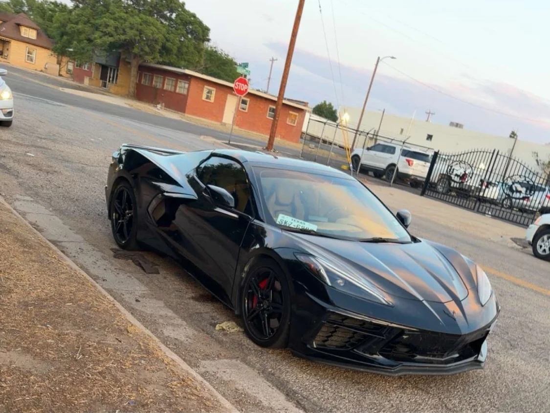 Black Chevrolet Corvette C8 with a deep gloss finish after detailing