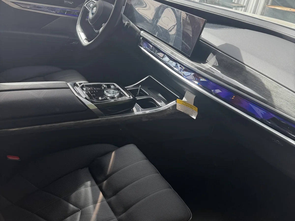 Detailed BMW driver-side interior, dash and console cleaned by hand